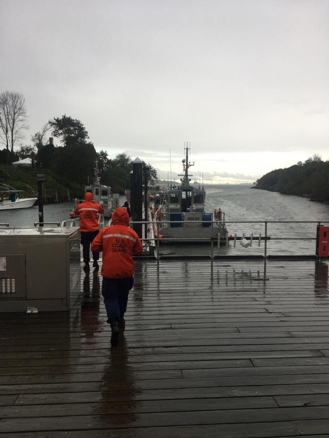 Coast Guard Station Castle Hill 45-response boat crew members race to their vessel to get underway after the search and rescue alarm goes off in Newport, Rhode Island on Saturday, Sept. 30, 2017. The crew saved five people and assisted four during a local regatta. © U.S. Coast Guard photo by Petty Officer 2nd Class