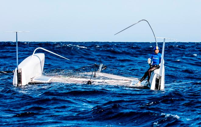 Day 1 – Erik Maris' Zoulou capsized in the big waves prior to racing today – GC32 Orezza Corsica Cup © Jesus Renedo / GC32 Racing Tour