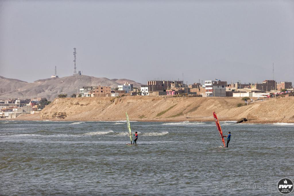 Sabine Zola (Green Ezzy) and Alessio Botteri (Red & Orange Severne) looking for waves during yesterday's Youth heat.  - Day 5 - Pacasmayo Wave Classic 2017 ©  Si Crowther / IWT