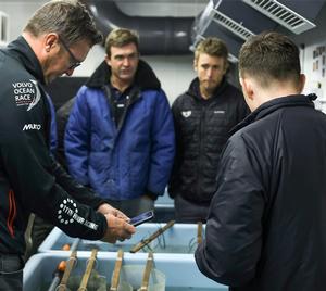 Sailors Phil Harmer, Charlie Enright, and Nick Dana look on as Dr. Huw Griffiths gives a tour around the British Antarctic Survey's aquarium which allows scientists to study specimens from the Antarctic Sea back in Cambridge. photo copyright Vestas 11th Hour Racing taken at  and featuring the  class