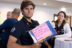 Sailor Tom Johnson make his pledge to protect the ocean, team member, Hannah Diamond looks on photo copyright Vestas 11th Hour Racing taken at  and featuring the  class