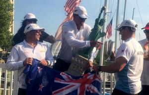 The winning team from the Royal Akarana Yacht Club in New Zealand receives the Statue of Liberty perpetual trophy – 11th International Yacht Club Challenge photo copyright Manhattan Yacht Club taken at  and featuring the  class