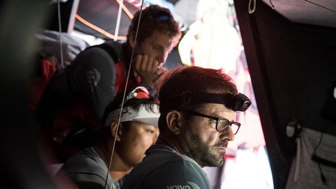 Crew looking frustrated around Nav Station – Volvo Ocean Race ©  Rich Edwards / Volvo Ocean Race