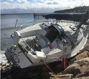 The sailing vessel Carina sits on rocks after being washed ashore near Apponagansett Bay, Massachusetts, after a powerful storm hit the Northeast, Sunday, Oct. 29, 2017. Coast Guard crews from Maine down to Rhode Island have identified over 50 vessels that were torn from their moorings and were found either unmanned and adrift or washed up on land photo copyright U.S. Coast Guard District 1 taken at  and featuring the  class