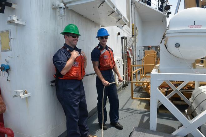 Seaman Brandon Gannon instructs embedded media reporter Blair Miller on line handling, Wednesday, Oct. 10, 2017. Coast Guard cutter Active has a crew complement of about 75. © Petty Officer 3rd Class Nicole J. Groll