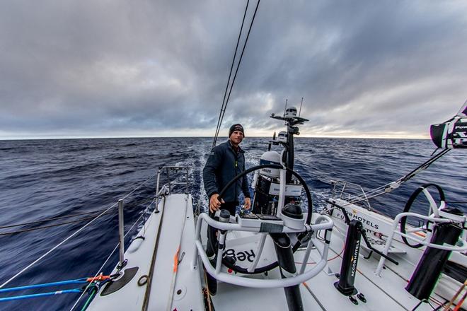 Day 14, Leg 2, Lisbon to Cape Town, Luke Parkinson early session on the wheel on board Sun Hung Kai/Scallywag – Volvo Ocean Race ©  Konrad Frost / Volvo Ocean Race