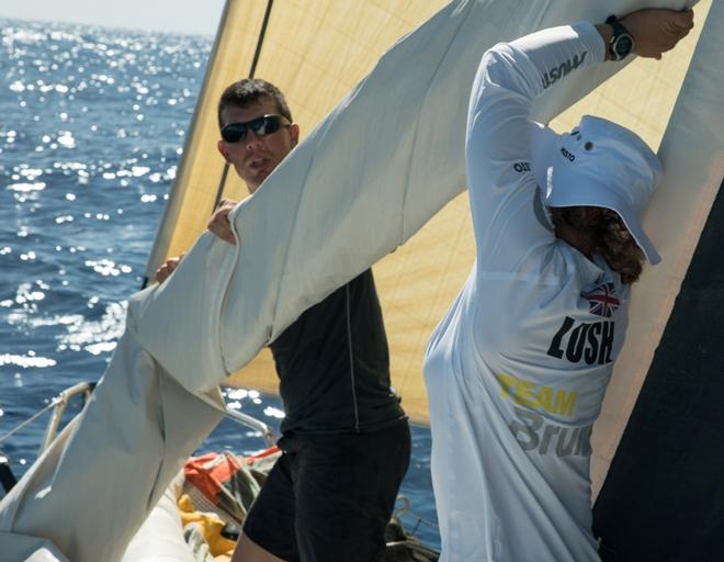 Leg 2, Lisbon to Cape Town, Annie and Carlo bring the sails down on board Brunel – Volvo Ocean Race ©  Rich Edwards / Volvo Ocean Race