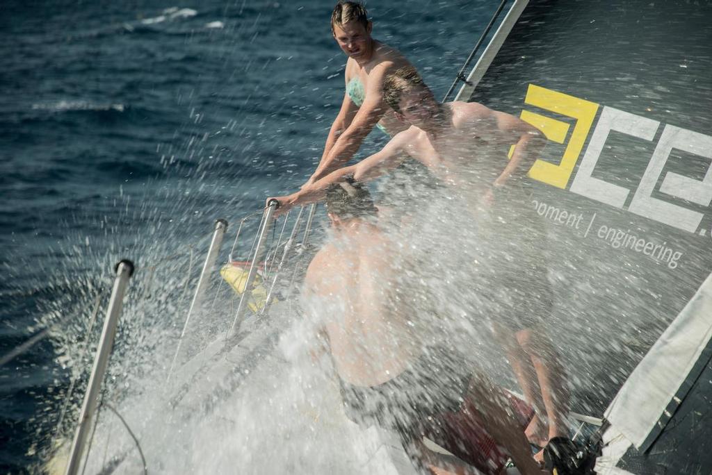 Leg 2, Day 9 on board Brunel. Lisbon to Cape Town, The america's cup guys take a shower on the bow, Volvo Ocean Race. 13 November, 2017 photo copyright  Rich Edwards / Volvo Ocean Race taken at  and featuring the  class