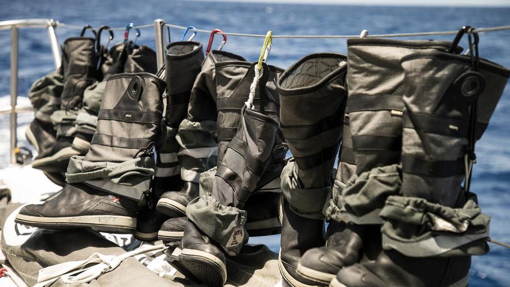 Leg 2, Day 12, Lisbon to Cape Town. Drying boots onboard a quieter moment on team Brunel. Volvo Ocean Race. 16 November, 2017 ©  Rich Edwards / Volvo Ocean Race