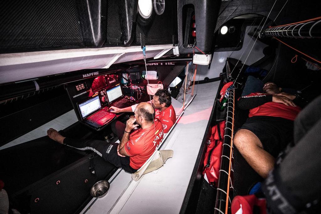 Leg 02, Lisbon to Cape Town, day 13, on board MAPFRE, Xabi Fernandez and Joan vila looking at the navigation strategy, Pablo Arrarte on his bank. Photo by Ugo Fonolla/Volvo Ocean Race. 17 November, 2017 ©  Ugo Fonolla / Volvo Ocean Race