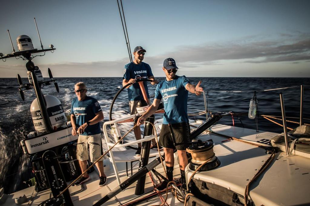 Leg 02, Lisbon to Cape Town, day 13, on board Vestas 11th Hour. Photo by Martin Keruzore/Volvo Ocean Race. 17 November, 2017. Tom Johnson is happy to see Nick Dana jumping on deck after a long nap. ©  Martin Keruzore / Volvo Ocean Race