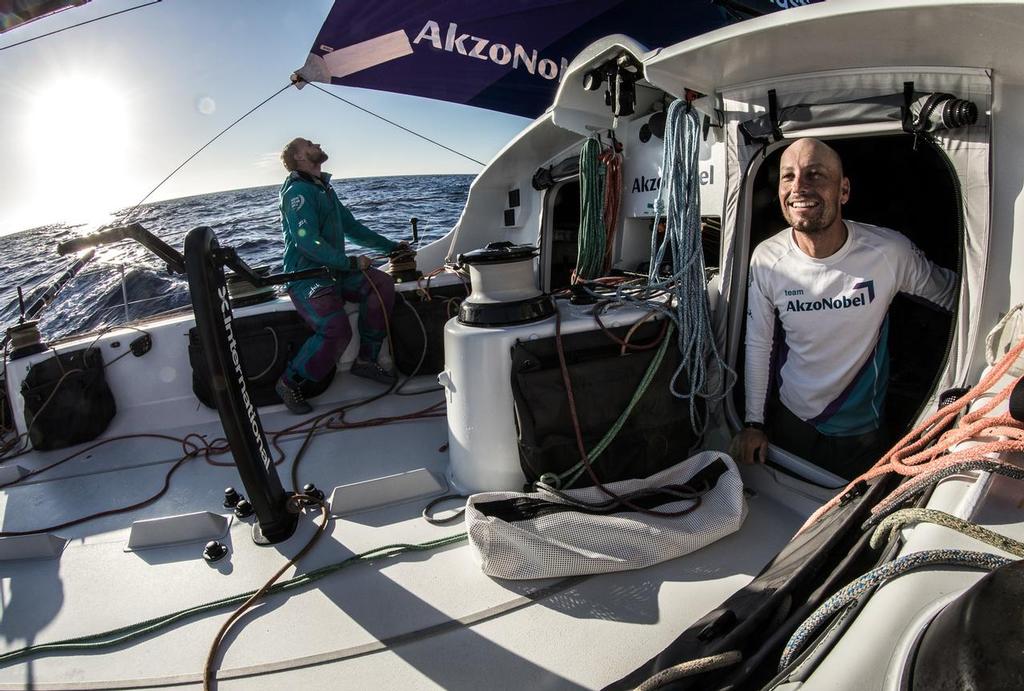 Leg 02, Lisbon to Cape Town, day 14,  on board AkzoNobel. Luke Molloy up with a smile as Brad Farrand trims. Photo by James Blake/Volvo Ocean Race. 18 November, 2017. ©  James Blake / Volvo Ocean Race