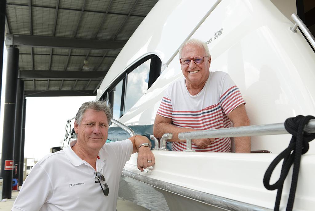 Captain Russell Flemming (glasses) on board the S70 with Maritimo's Graig Jones as fuel bladders were fitted and the vessel was made ready for the crossing at Maritimo's Boatmasters facility, Hope Island. © Promedia