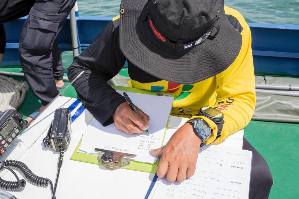 There's always paperwork. 2017 Raja Muda Selangor International Regatta. © Guy Nowell / RMSIR