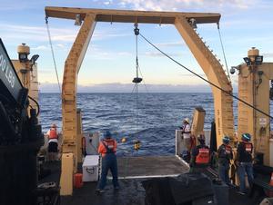 Crew members deploy a high-frequency acoustic recording package to detect cetacean sounds underwater photo copyright NOAA Fisheries taken at  and featuring the  class