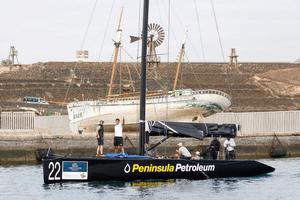 Peninsula Petroleum owner John Bassadone waves from the bow as the teams return to Marina Lanzarote to await further instructions – RC44 Calero Marinas Cup photo copyright  Martinez Studio / RC44 Class taken at  and featuring the  class
