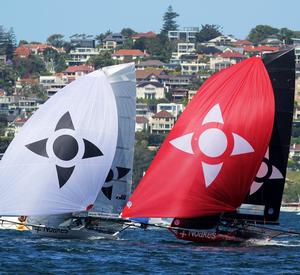 The two NOAKES skiffs (Noakes Youth with the white spinnaker and Noakesailing with red) photo copyright  Frank Quealey / Australian 18 Footers League taken at  and featuring the  class