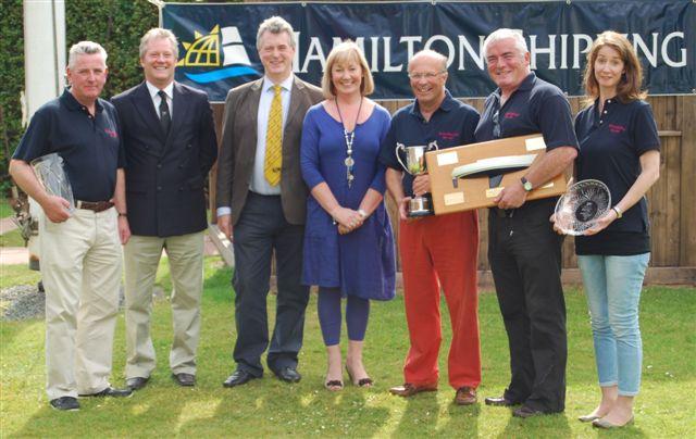 Hamilton Shipping Finance Director Ken Craig and his wife Tricia with  RUYC Rear Commodore Stephen Graham and the crew of White Mischief photo copyright Ken Hunter taken at Royal Ulster Yacht Club and featuring the Sigma 33 class