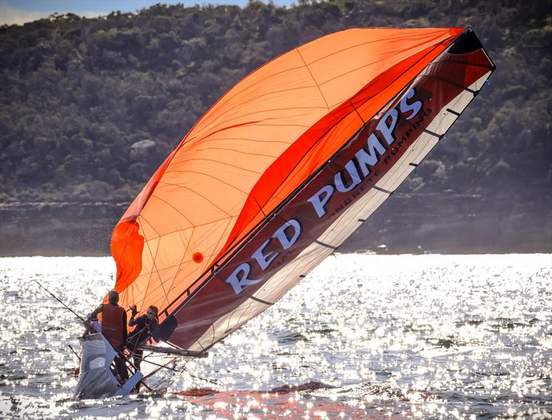 Slow motion capsize for Red Pumps Red Bruce Savage, James Slee & Natalia Wisniewski photo copyright Sail Media taken at Manly 16ft Skiff Sailing Club and featuring the 16ft Skiff class