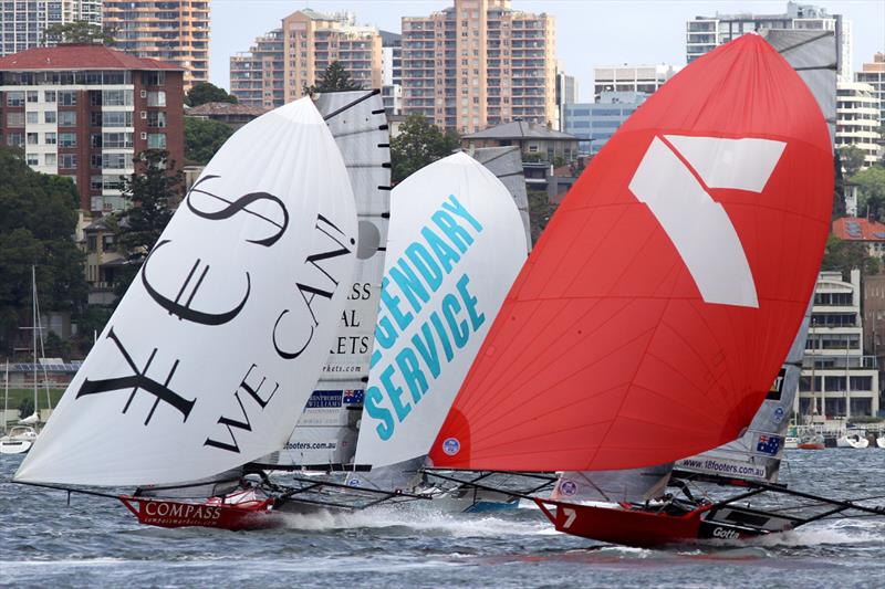 Compassmarkets.com, Appliancesonline.com.au and Gotta Love It 7 close action on the first spinnaker run during race 2 of the 18ft Skiff NSW Championship photo copyright Frank Quealey taken at Australian 18 Footers League and featuring the 18ft Skiff class