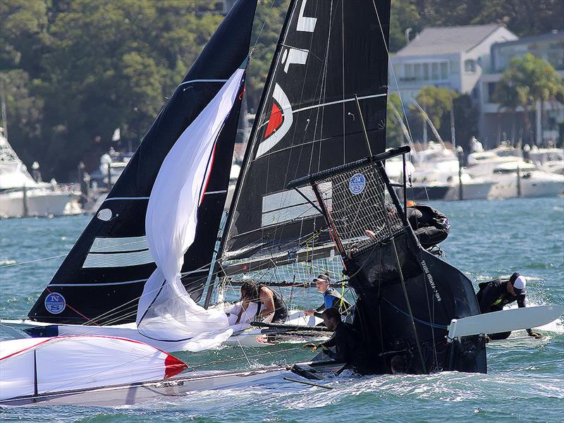 Vintec passes a capsized Rag and Famish Hotel during the 18ft Skiff Queen of the Harbour - photo © Frank Quealey