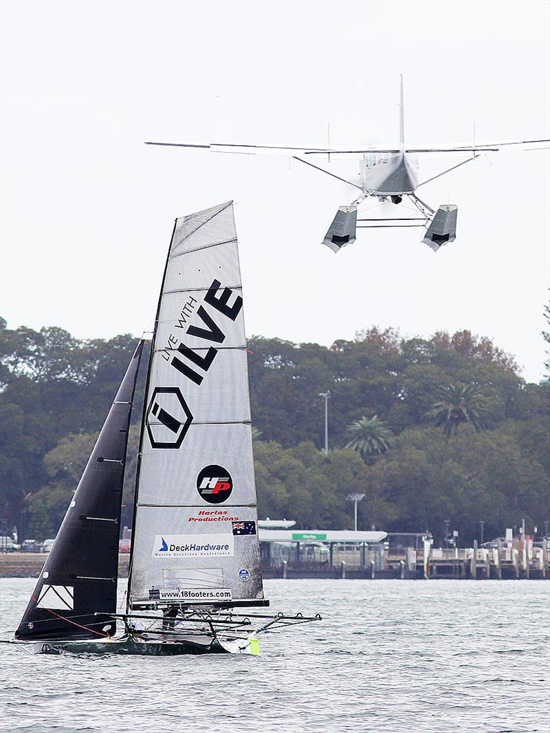 Ilve shares Sydney Harbour with a local sea plane on day 5 of the 18ft Skiff JJ Giltinan Championship  photo copyright Frank Quealey taken at Australian 18 Footers League and featuring the 18ft Skiff class