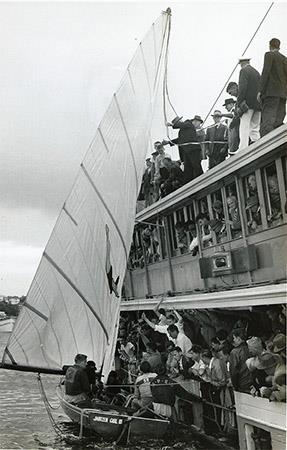 Jantzen Girl III accepts the winner's ribbon for 1958 JJ Giltinan World Championship victory photo copyright Archive taken at Australian 18 Footers League and featuring the 18ft Skiff class