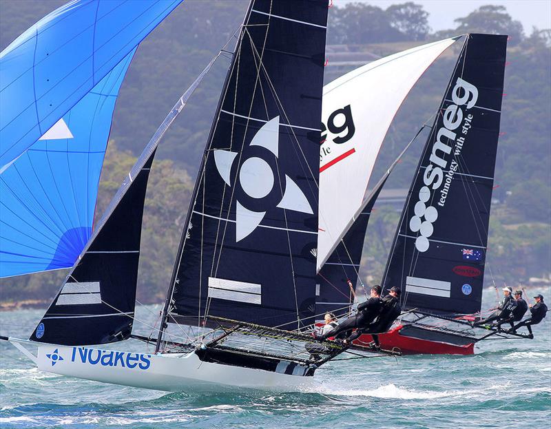 Yvette Heritage drives her Noakes Blue skiff hard in a high speed spinnaker run with Smeg - photo © Frank Quealey