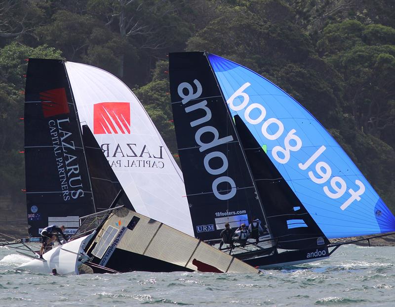 Andoo and Lazarus Capital Partners race past a capsized Bird and Bear during Race 8 of the 18ft Skiff Australian Championship - photo © Frank Quealey