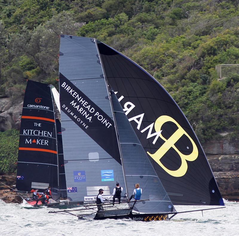 18ft Skiff JJ Giltinan Championship day 1: Birkenhead Point Marina passes The Kitchen Maker, which is strugling to stay off the rocks photo copyright Frank Quealey taken at Australian 18 Footers League and featuring the 18ft Skiff class
