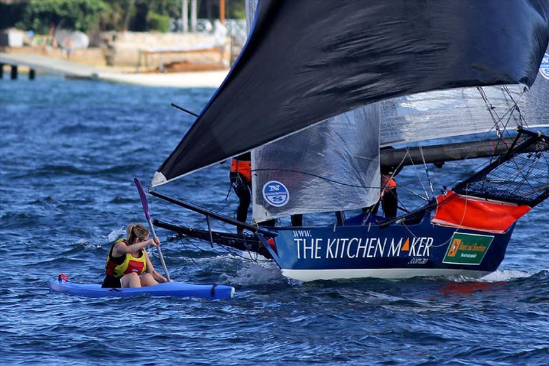A kayaker nearly has a nasty collision on Sydney Harbour  photo copyright Frank Quealey taken at  and featuring the 18ft Skiff class