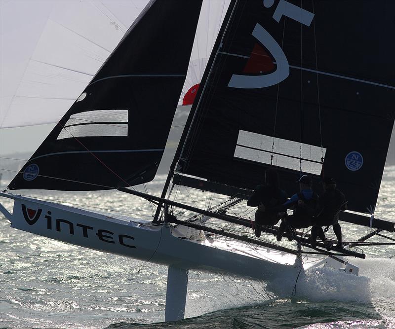 Young Vintec crew drive their skiff hard downwind - photo © Frank Quealey