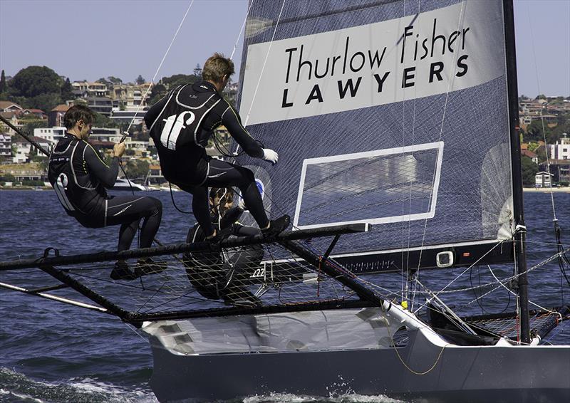 Michael Coxon with the tiller on Thurlow Fisher Lawyers photo copyright John Curnow taken at Australian 18 Footers League and featuring the 18ft Skiff class