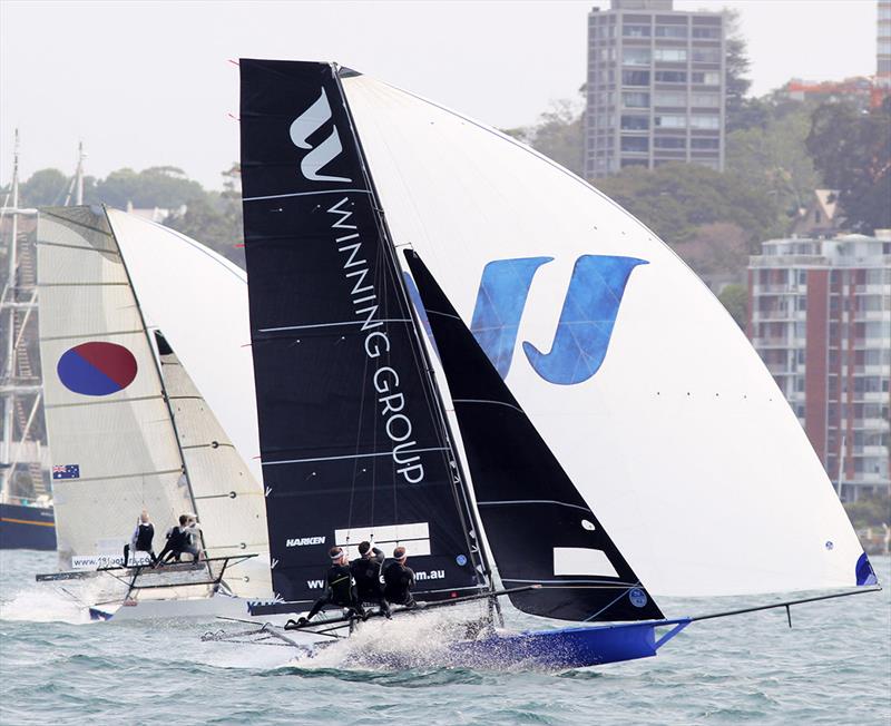A battle of father and son as John Winning Jr's Winning Group leads John Winning's Yandoo down the long spinnaker run from Rose Bay to Kurraba Point - 18ft Skiff NSW Championship 2019 photo copyright Frank Quealey taken at Australian 18 Footers League and featuring the 18ft Skiff class