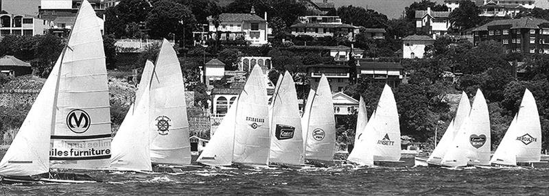 The Kulmar Family - Miles Furniture wins the start of a championship race in the 1974-75 Season photo copyright Frank Quealey taken at Australian 18 Footers League and featuring the 18ft Skiff class