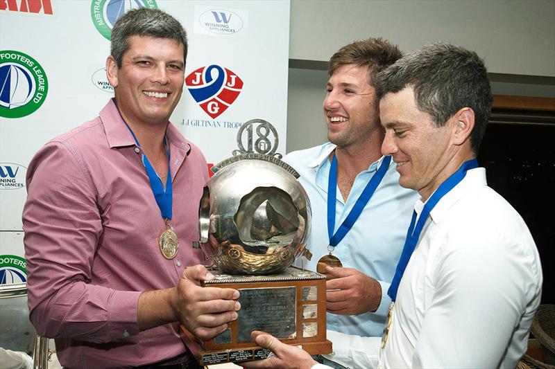 2013 JJ Giltinan Championship winning Gotta Love It 7 team accept the trophy (from left Peter Harris, Seve Jarvin, Scott Babbage) photo copyright Frank Quealey taken at Australian 18 Footers League and featuring the 18ft Skiff class