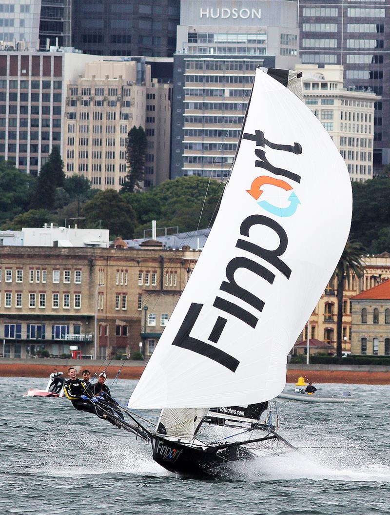 The Finport Finance team leaves a capsized competitor behind on the downwind leg - 18ft Skiffs Supercup - December 2021 photo copyright Frank Quealey taken at Australian 18 Footers League and featuring the 18ft Skiff class