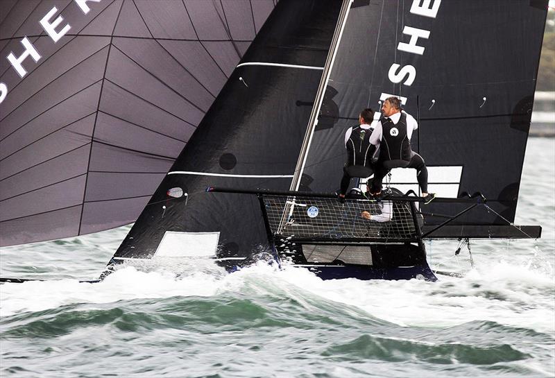 Fisher and Paykel's team had to survive the wake of a power boat which crossed the skiff's bow - photo © Frank Quealey