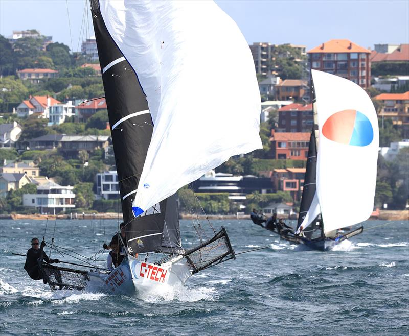 Queensland's C-Tech leads Yandoo on the spinnaker run to Chowder Bay during race 1 of the 100th 18ft Skiff Australian Championship - photo © Michael Chittenden
