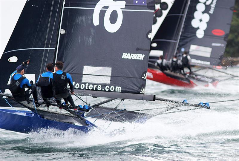 Andoo (blue boat) charges but can't catch race 2 winner Smeg as they cross the finish line in the 100th 18ft Skiff Australian Championship photo copyright Frank Quealey taken at Australian 18 Footers League and featuring the 18ft Skiff class