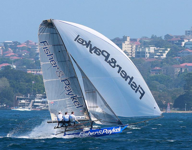 2010-11 Fisher & Paykel crew on a spinnaker run down the centre of Sydney Harbour photo copyright Frank Quealey taken at Australian 18 Footers League and featuring the 18ft Skiff class