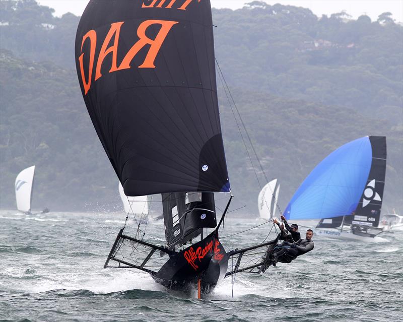 The Rag and Famish Hotel heads for the finish line to win Race 5 of the 18ft Skiff Spring Championship photo copyright Frank Quealey taken at Australian 18 Footers League and featuring the 18ft Skiff class