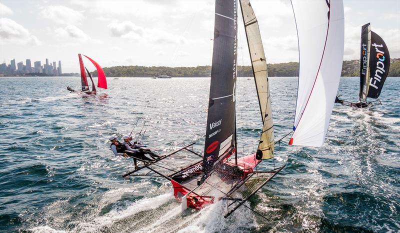 Smeg chasing Finport Finance photo copyright Michael Chittenden taken at Australian 18 Footers League and featuring the 18ft Skiff class