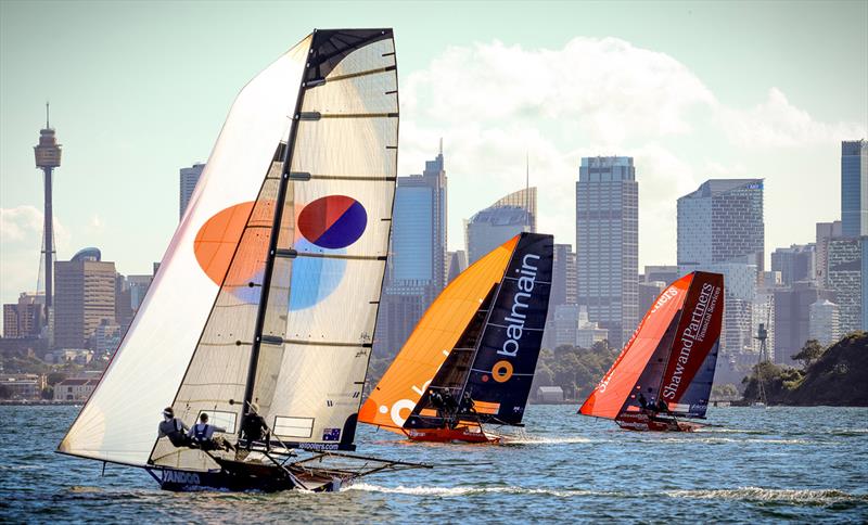 A typical spinnaker run to the bottom mark off Clark Island in a summer Nor'Easter photo copyright SailMedia taken at Australian 18 Footers League and featuring the 18ft Skiff class