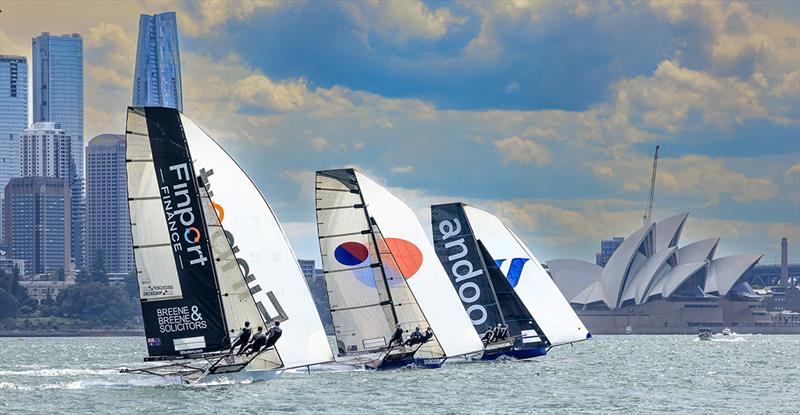 Australian champion Finport Finance chases Andoo and Yandoo down the spinnaker run in Race 1 of the NSW 18ft Skiff Championship photo copyright SailMedia taken at Australian 18 Footers League and featuring the 18ft Skiff class