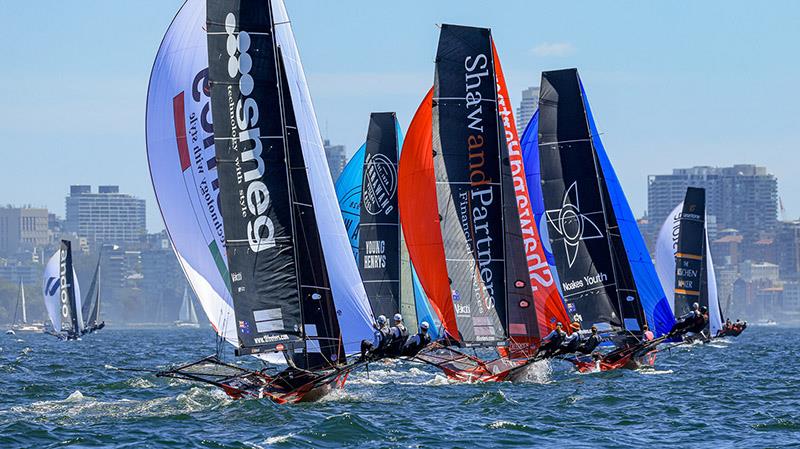 Fleet on a spinnaker run in Race 2 - 18ft Skiffs: Australian Championship photo copyright SailMedia taken at Australian 18 Footers League and featuring the 18ft Skiff class