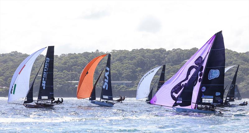 Winnings 2025 JJ Giltinan 18ft Skiff Championship Race 2: Bigfoot roll into a gybe photo copyright SailMedia taken at Australian 18 Footers League and featuring the 18ft Skiff class