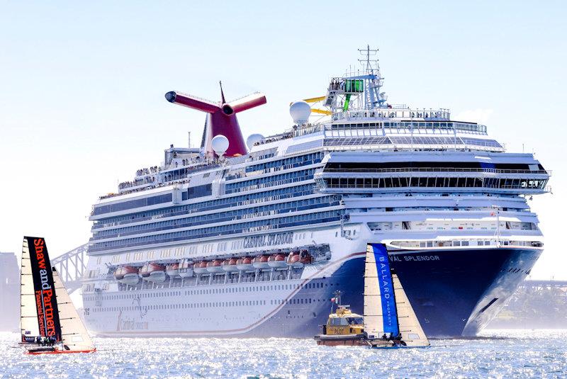 Skiffs challenge the cruise ship - photo © SailMedia