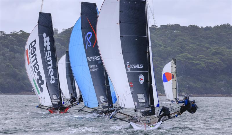 Bunched spinnakers in the second race - 2025-26 Australian 18ft Skiff Championship Day 3 photo copyright SailMedia taken at Australian 18 Footers League and featuring the 18ft Skiff class