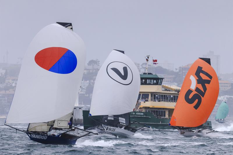 Harbour traffic and the 18s photo copyright SailMedia taken at Australian 18 Footers League and featuring the 18ft Skiff class
